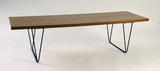 Table basse rectangulaire modèle « CM191 » à plateau bois sur un piétement en métal laqué noir. 1957, Edition Thonet - Galerie Kréo. H : 37, l : 140, P : 47 (cm)